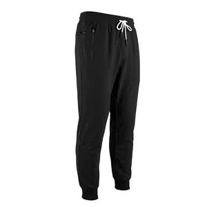 Side view detail of men's black jogger pants featuring zipper pockets and white drawstring