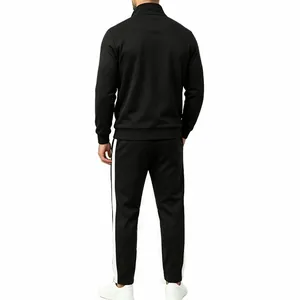 Back view of men's black tracksuit featuring white side stripes and zip-up jacket