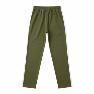 Detailed view of olive green sports sweatpants with classic white side stripes and elastic waist.