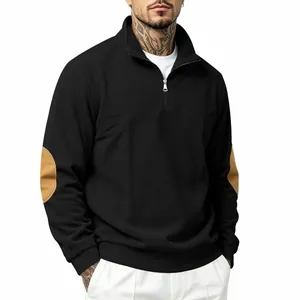 Detailed view of men's black ribbed sweatshirt with quarter zip and elbow patches