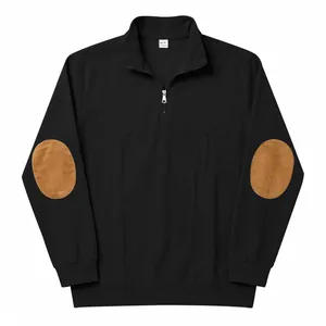 Detail view of black ribbed half-zip sweatshirt with brown suede elbow patches