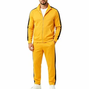 Detailed view of men's yellow casual sports suit with black side stripes and full zipper