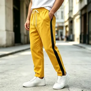 Casual loose fit yellow men's joggers featuring a black side stripe and drawstring