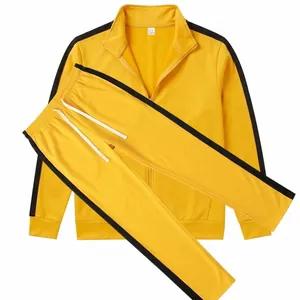 Two-piece yellow tracksuit with black side stripes, full zip jacket and drawstring pants