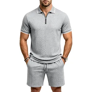 Front view of men's grey diamond jacquard polo and shorts set on model