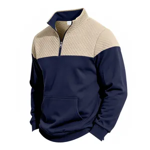 Close-up of men's color-block pullover featuring quilted upper and stand-up collar
