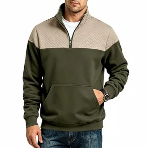 Detail of men's quarter-zip sweatshirt with quilted texture and color-block design