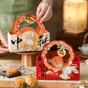 Detailed view of festive Mid-Autumn rabbit mooncake packaging boxes with handle design