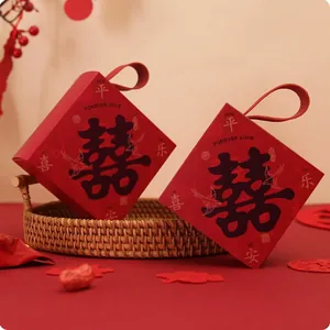 Detailed view of red Chinese wedding candy boxes with Double Happiness character