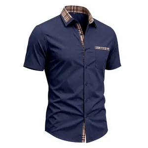 Detailed view of navy blue men's short sleeve shirt with plaid contrast collar
