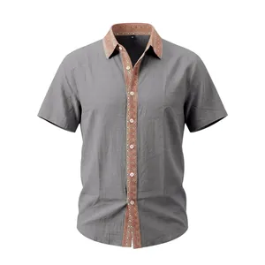 Detail of men's grey linen shirt with vintage patterned collar and placket.
