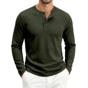 Close-up of olive green waffle knit Henley shirt with classic button neck detail.