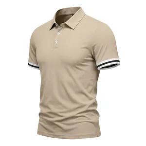 Close-up detail of men's beige polo shirt featuring contrast double striped cuffs