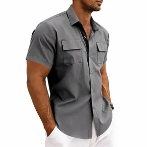 Detail of grey short-sleeve cargo shirt featuring dual chest pockets and button closure.