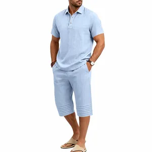 Casual men's two-piece cotton linen set featuring light blue polo shirt and capri shorts