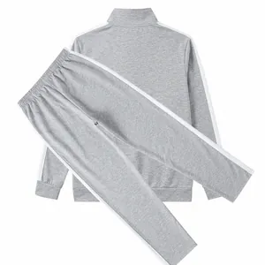 High-quality detail view of men's gray tracksuit set with white contrast side stripes