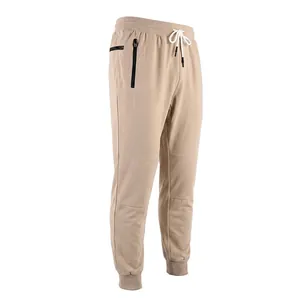 Side view of khaki men's sports joggers with elastic waist and black zipper pocket