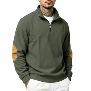 Detail of men's ribbed half-zip sweatshirt with elbow patches in olive green