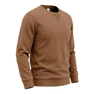 Detailopname van bruin corduroy sweatshirt met driehoekige nekpatch en elleboogstukken
