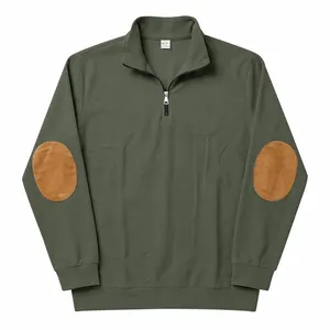 Detailed view of olive green ribbed half-zip sweatshirt with brown suede elbow patches.