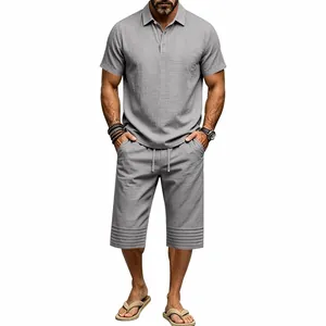 Detailed look of men's grey cotton linen two-piece polo and drawstring shorts set