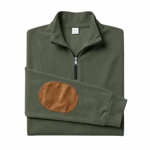 Close-up of olive green ribbed sweatshirt with half-zip and brown elbow patches