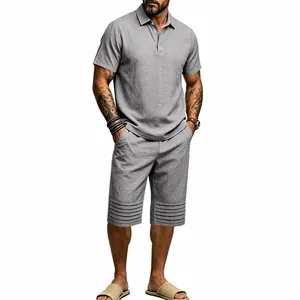 Close-up view of men's casual gray linen two-piece set featuring striped hem details