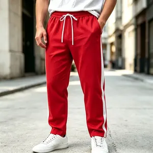 Detail view of men's red casual sweatpants with white side stripes and drawstring