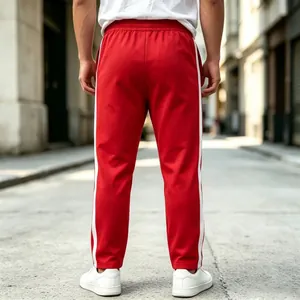 Back view of men's red sweatpants with white side stripes for casual and sports wear