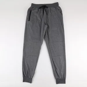 Full view of grey men's joggers with drawstring waist and functional zipper pockets