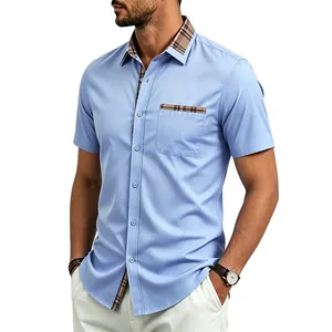 Detail view of light blue men's short-sleeved shirt with plaid contrast collar and pocket