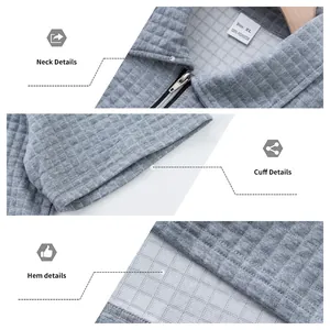 Détails en gros plan montrant la texture du tissu jacquard gris sur le col et l'ourlet