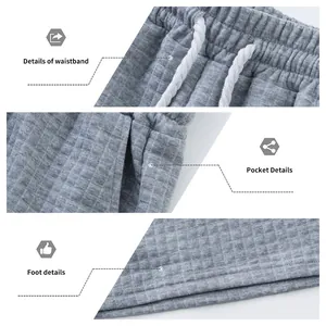 Vue macro des détails du tissu matelassé jacquard gris sur short pour homme