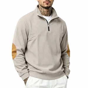 Detail view of men's ribbed half-zip sweatshirt featuring decorative brown elbow patches
