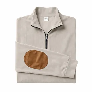 Detail of men's ribbed quarter-zip sweatshirt with brown elbow patches in beige