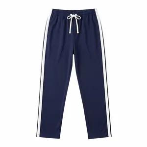 Front view of navy blue sports sweatpants featuring white side stripes and drawstring.