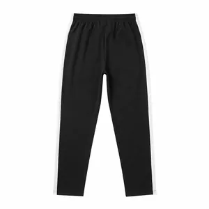 Detail shot of men's casual black sweatpants featuring stylish white side stripes.