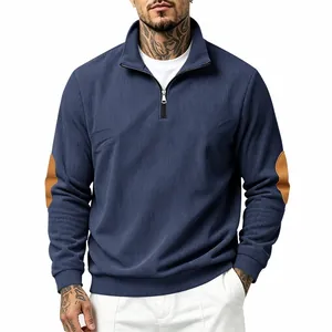 Stylish men's navy blue ribbed half-zip sweatshirt featuring decorative brown elbow patches