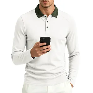 Detailed view of men's white long sleeve polo shirt with green contrast rib collar