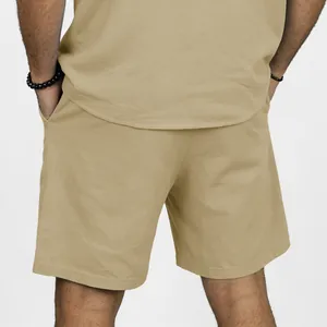 Men's khaki linen shorts back view showing casual beach style texture