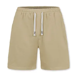 Detailed view of men's khaki linen shorts with an adjustable white drawstring waist
