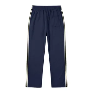 Back view of navy blue men's track pants featuring contrast side stripes and a rear pocket