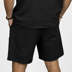 Detailed back view of men's casual solid black linen beach shorts with side pockets