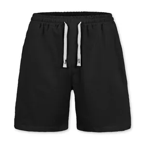 Detail shot of black linen shorts for men with elastic drawstring waist for beach casual wear