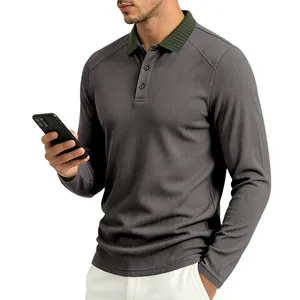 Detail of men's long sleeve Polo shirt with textured fabric and contrast rib collar.