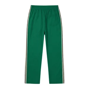 Back view of green men's casual joggers with contrasting side tape and a rear pocket
