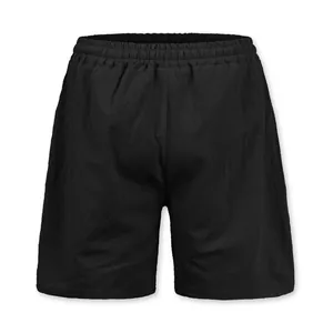 Detailed view of black linen shorts featuring elastic waist and breathable fabric texture.