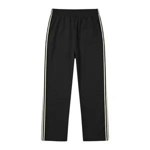 Rear view of men's black sports pants featuring cream side stripes and a single back pocket