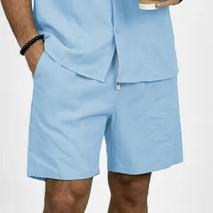 Close-up of light blue men's linen shorts with pocket detail and casual fit