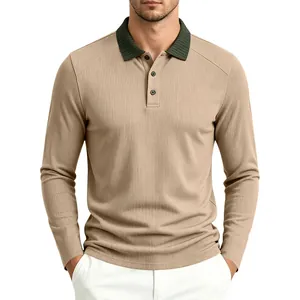 Detail showing the textured fabric and contrast green rib collar of the men's polo shirt.